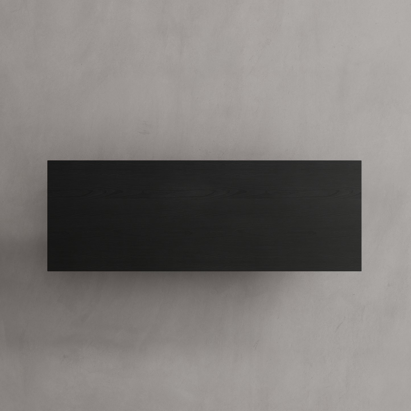 Top view of a minimalist ebonized oak coffee table with a dark finish, displayed in a modern interior setting