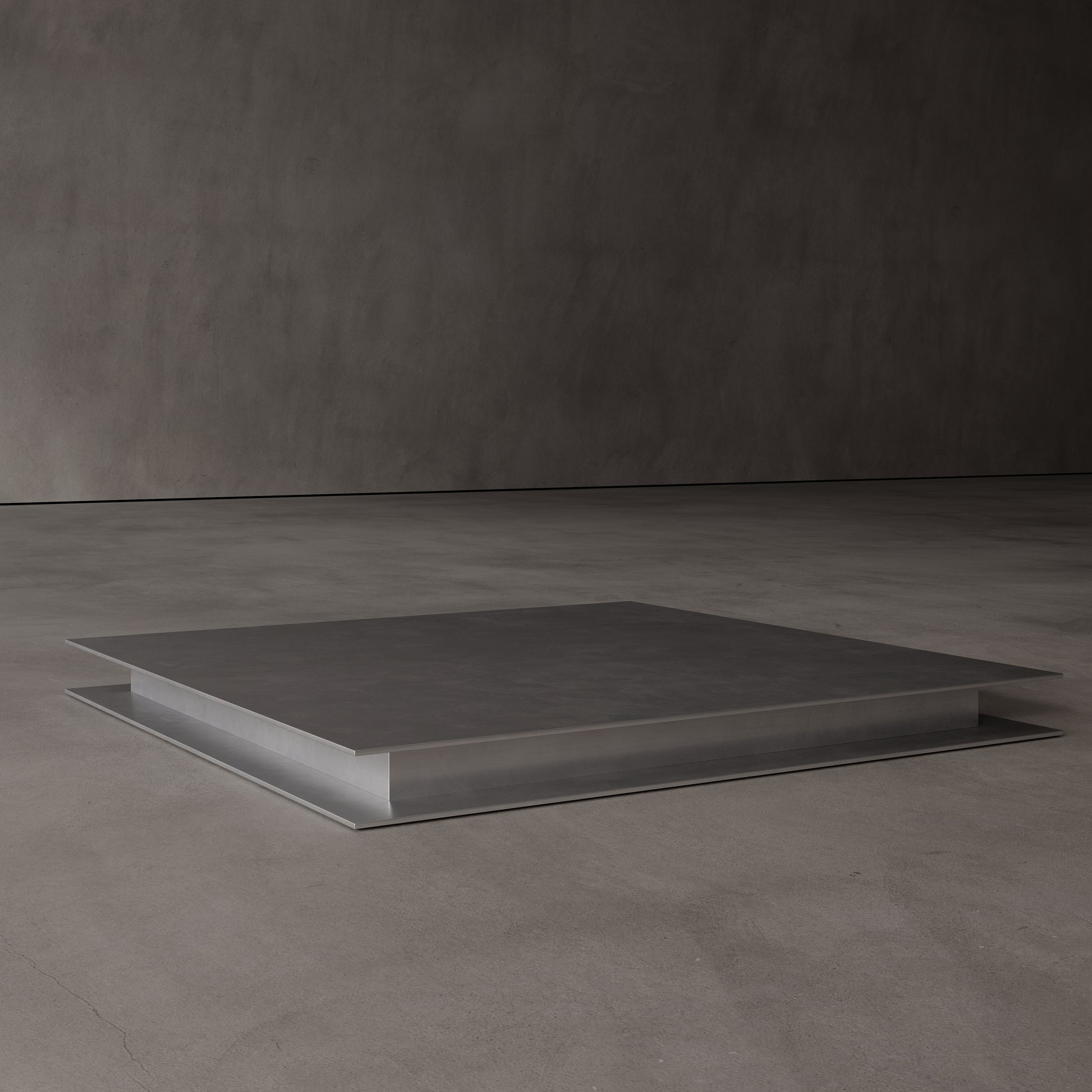 Square low coffee table made from metal on a dark gray background
